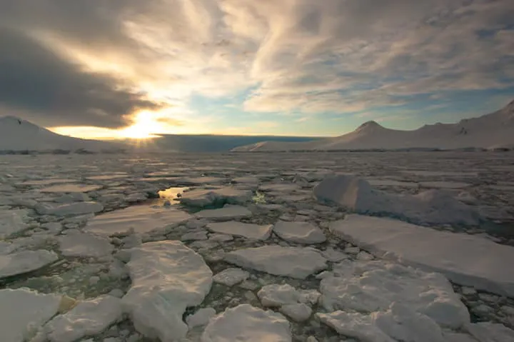 sun rising in the Antarctica wilderness 