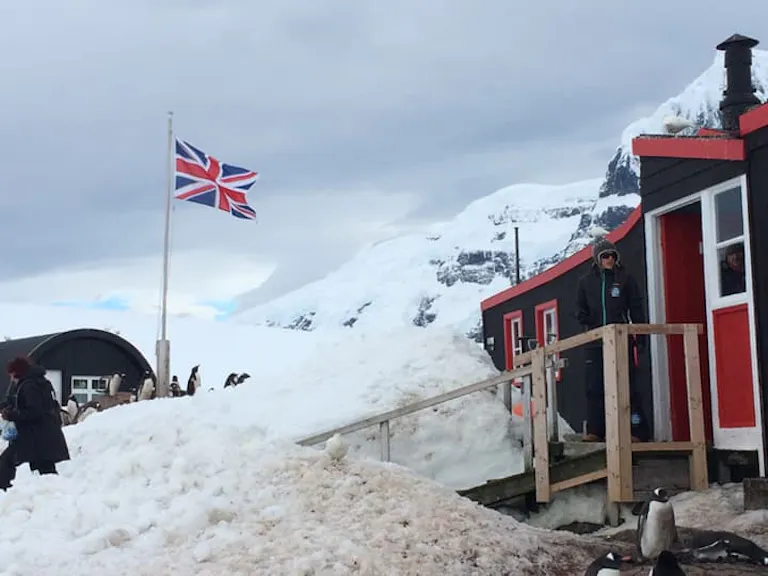 a English flag waving near a traveler's lodge, an accommodation in Antarctica