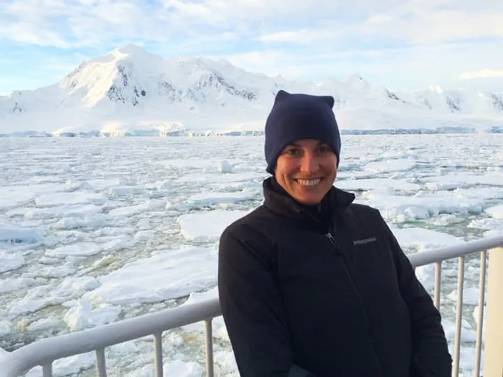 solo traveler with warm athletic gear who is exploring Antarctica 