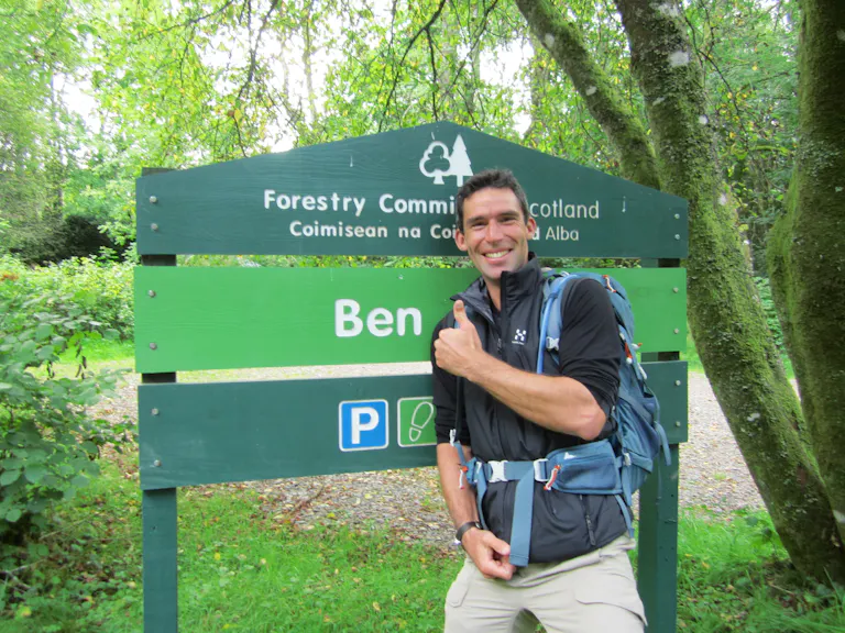 sign with the forest behind it. classic mountain adventure for 2023