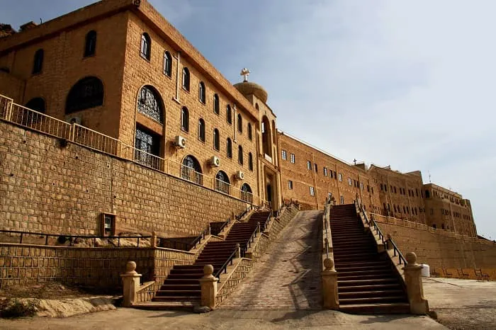 A large building with stairs leading up to it.
