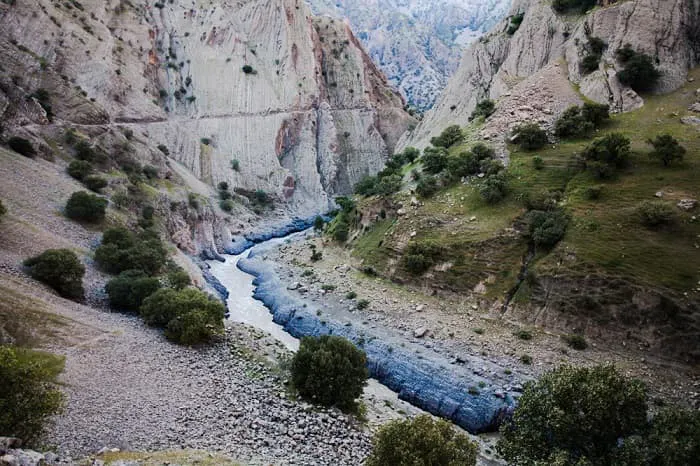 A river runs through a canyon in a mountainous area.
