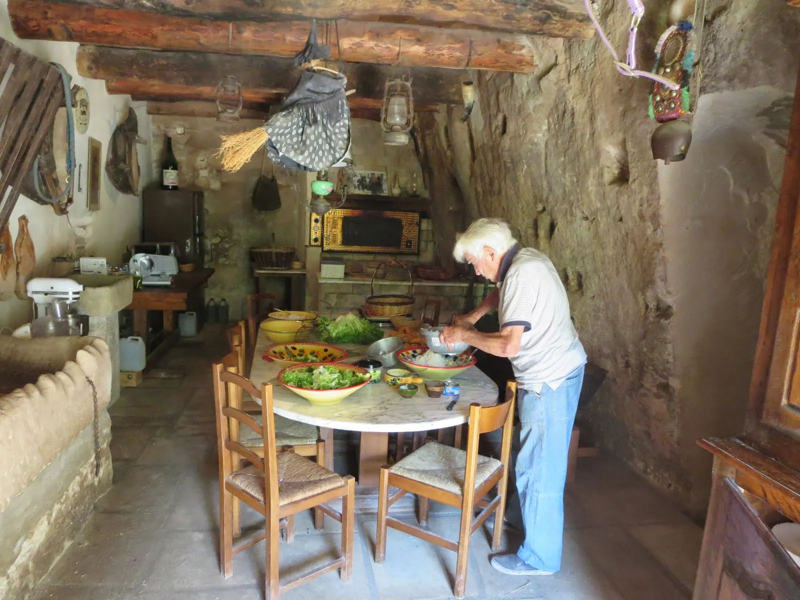 A man is preparing food in a kitchen.