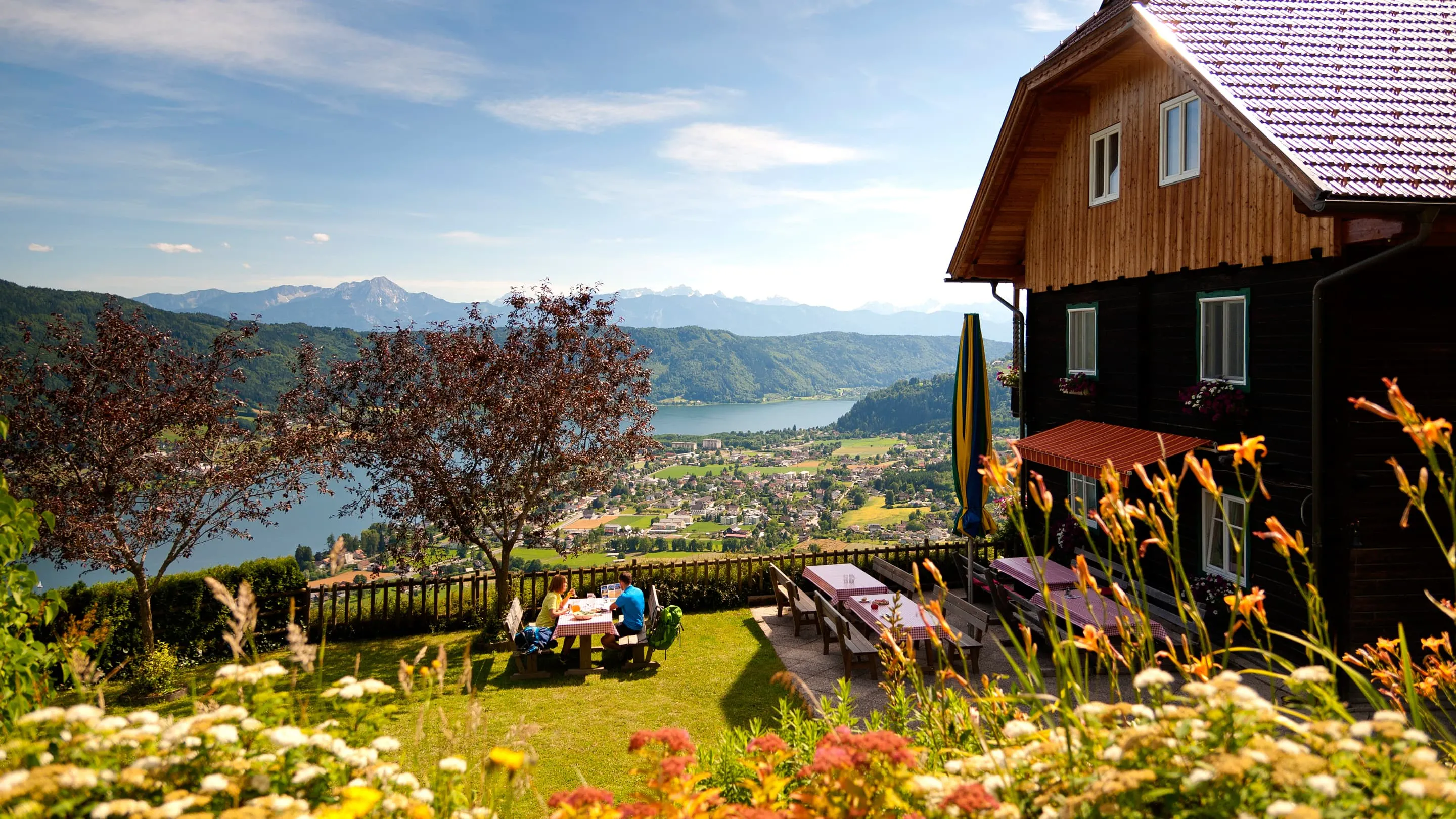A summer house on a hill with lake views.