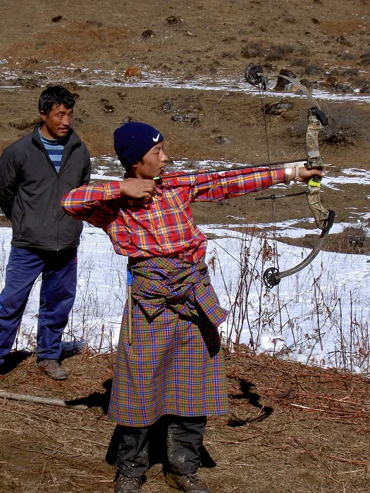A man with a bow and arrow.