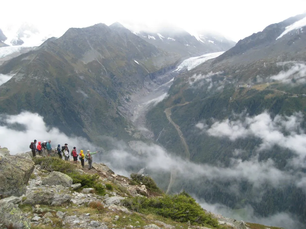 A group of people standing on top of a mountain.