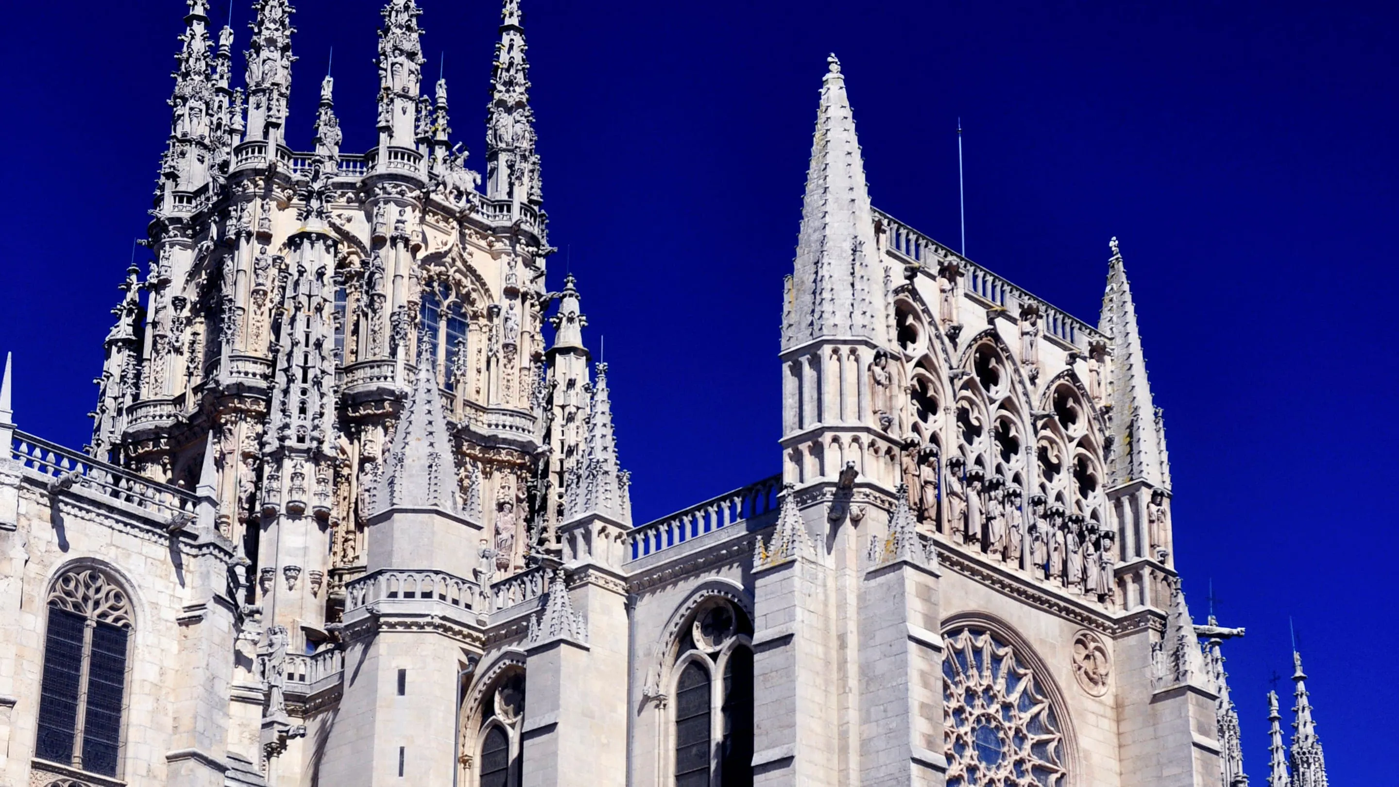 A large gothic cathedral against a blue sky.