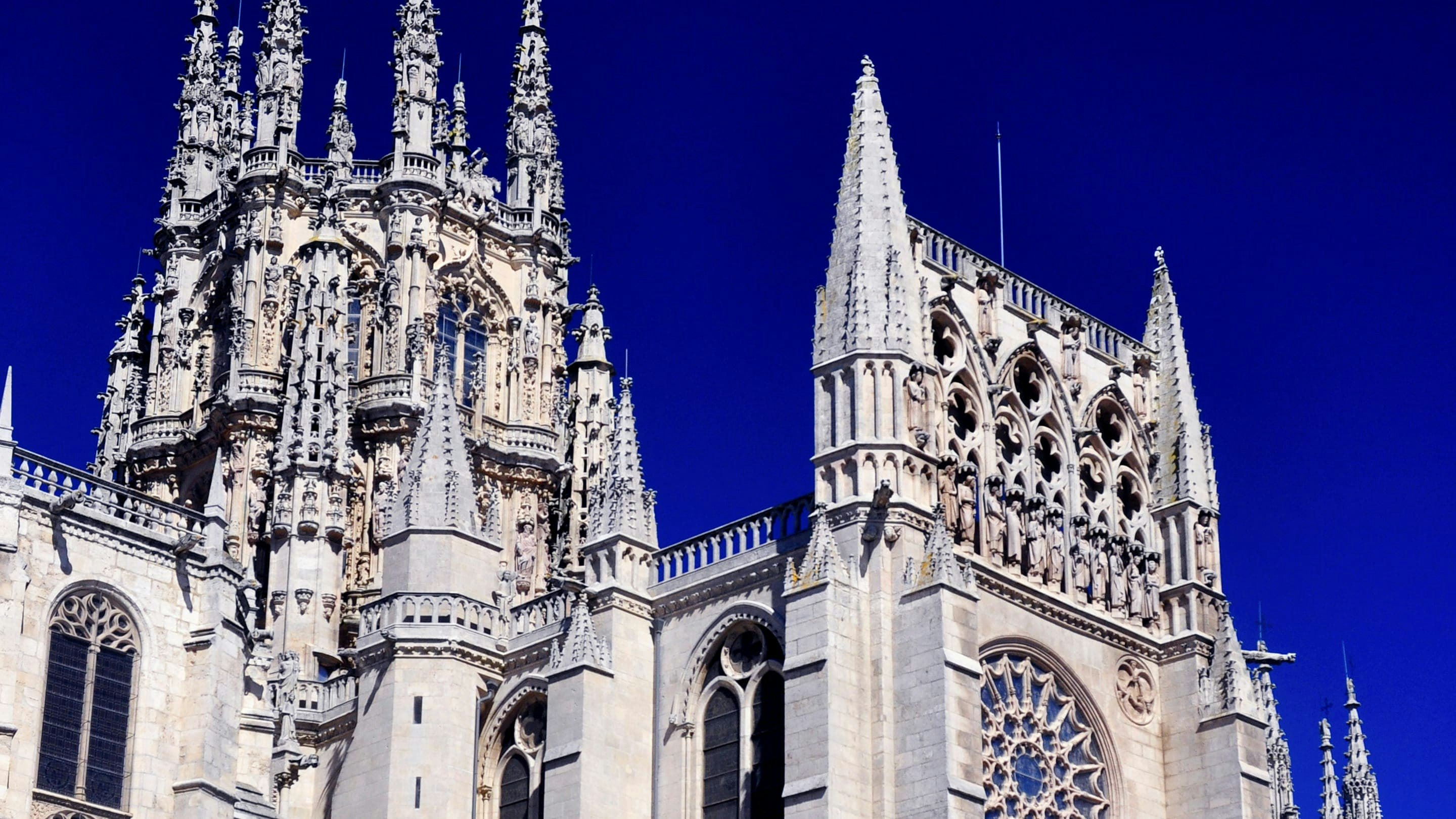 A large gothic cathedral against a blue sky.
