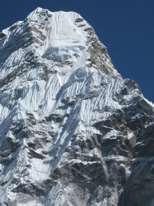 The top of a mountain with snow on it.