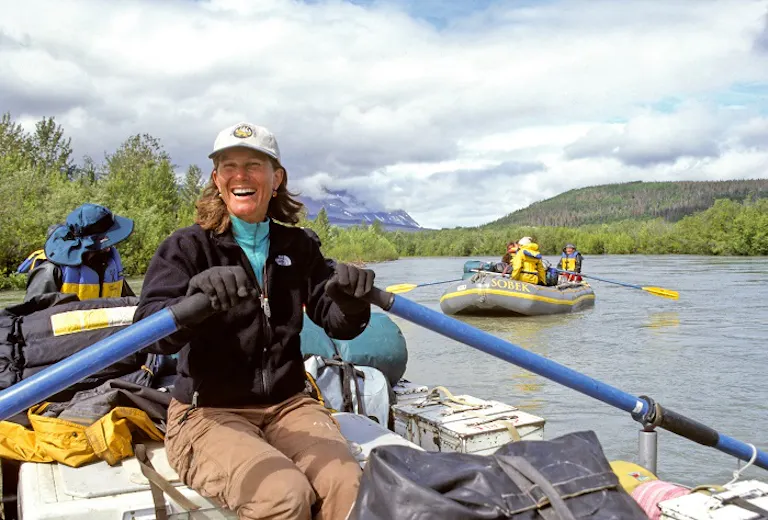 female Woman rafting with MT Sobek group on the Tatshenshini River in Alaska.
