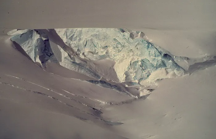 An image of a glacier with a hole in it.
