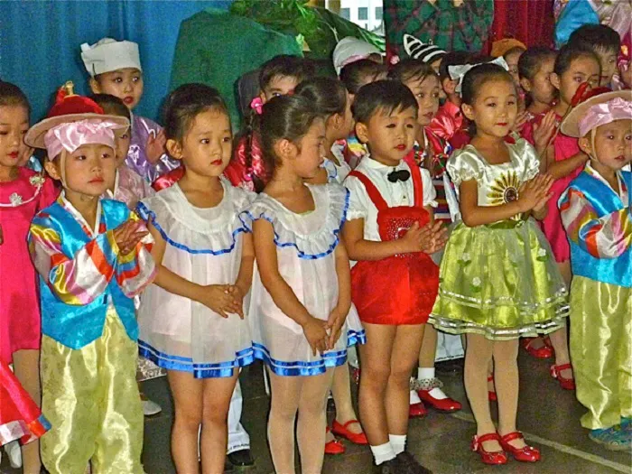 A group of children dressed up in costumes.