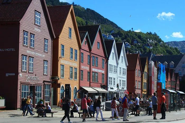 A row of colorful buildings on a street.