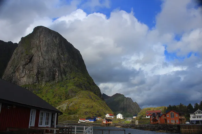 A small town with a mountain in the background.