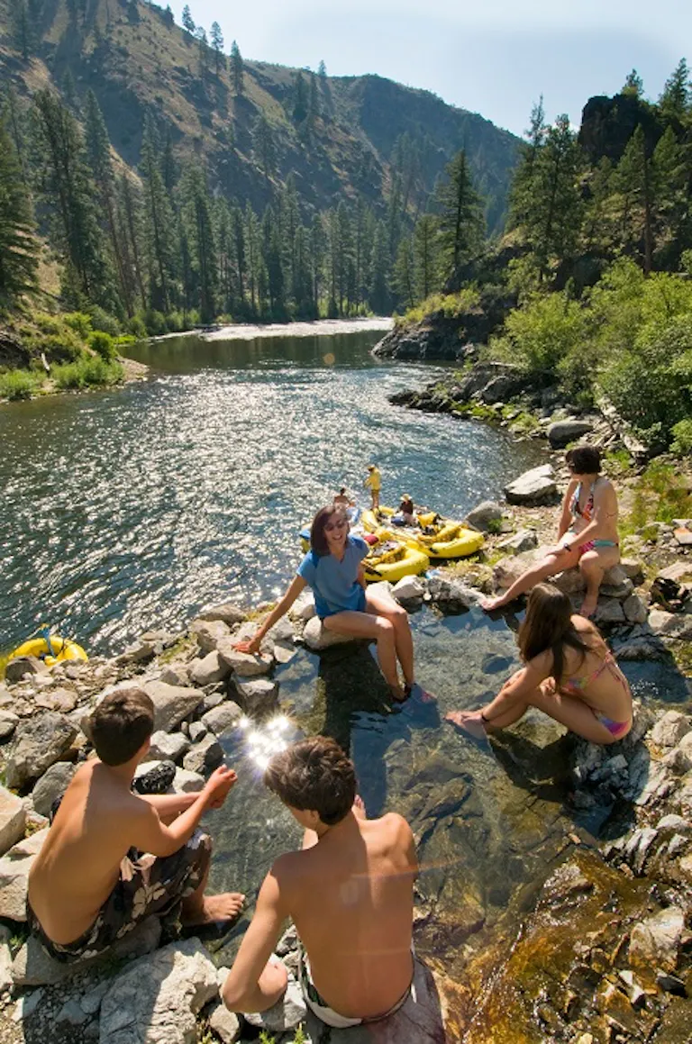 group of friends hanging out for fun during their Middle Fork of the Salmon River camping multi-day trip in Idaho, North America