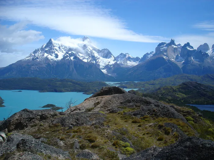 A view of a lake with mountains in the background.