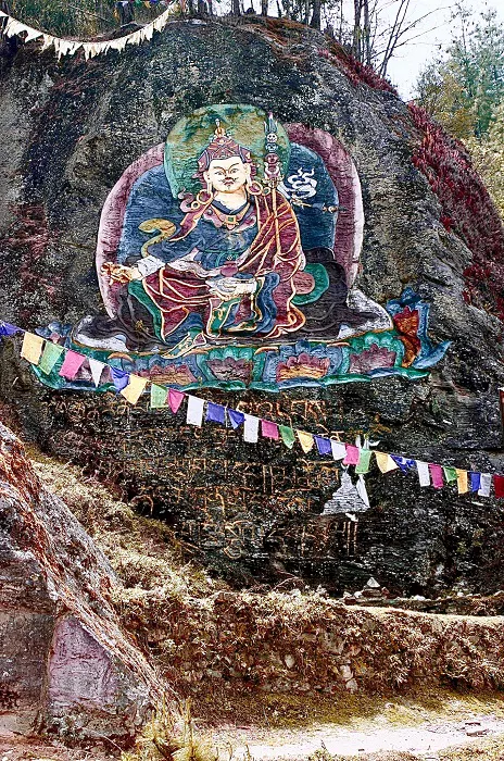 Buddha painting on the side of a rock.