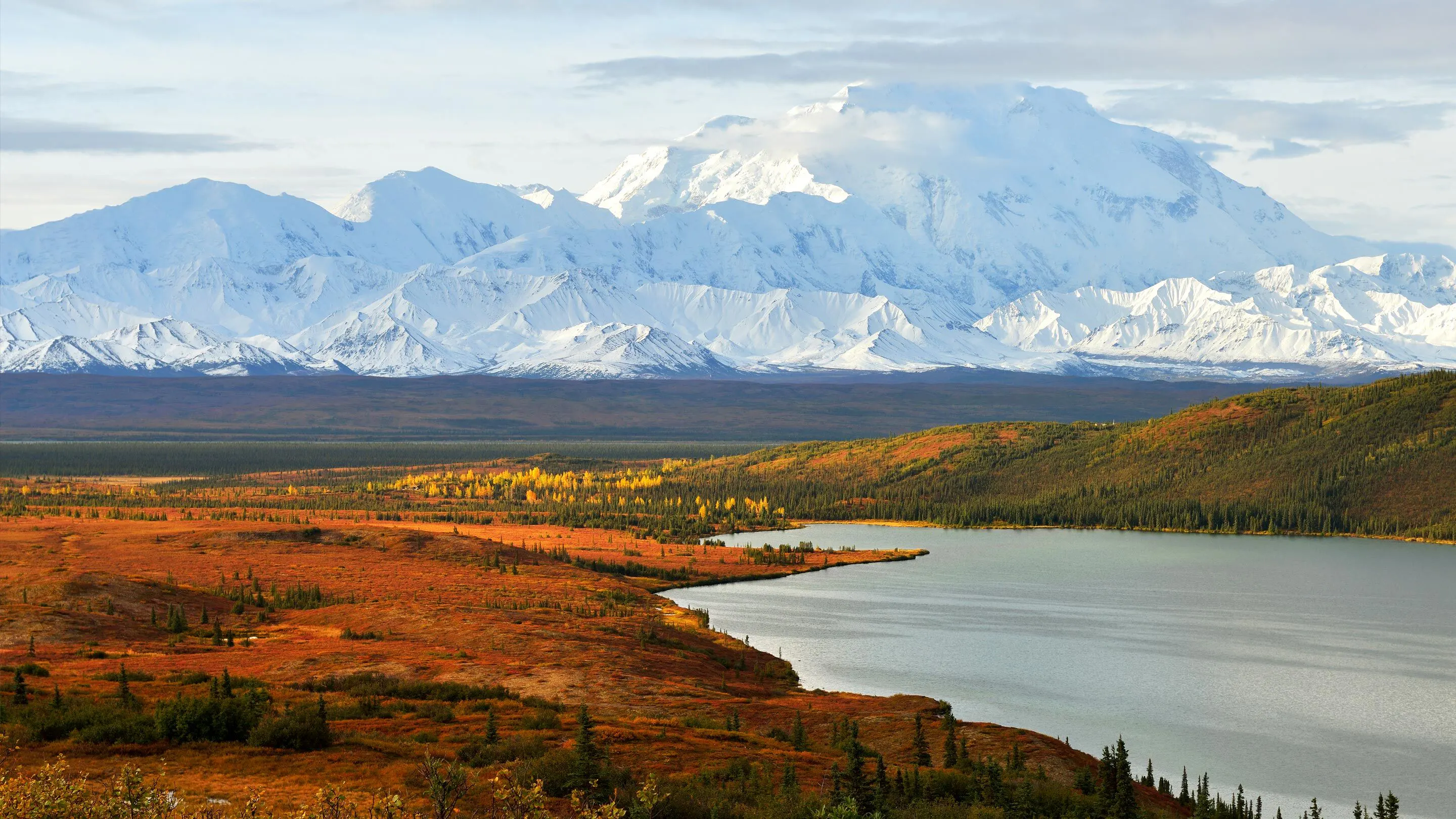 A lake with mountains in the background.