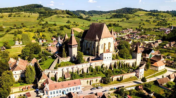 An aerial view of a village in the countryside.