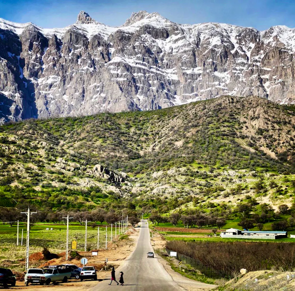 A road with mountains in the background.