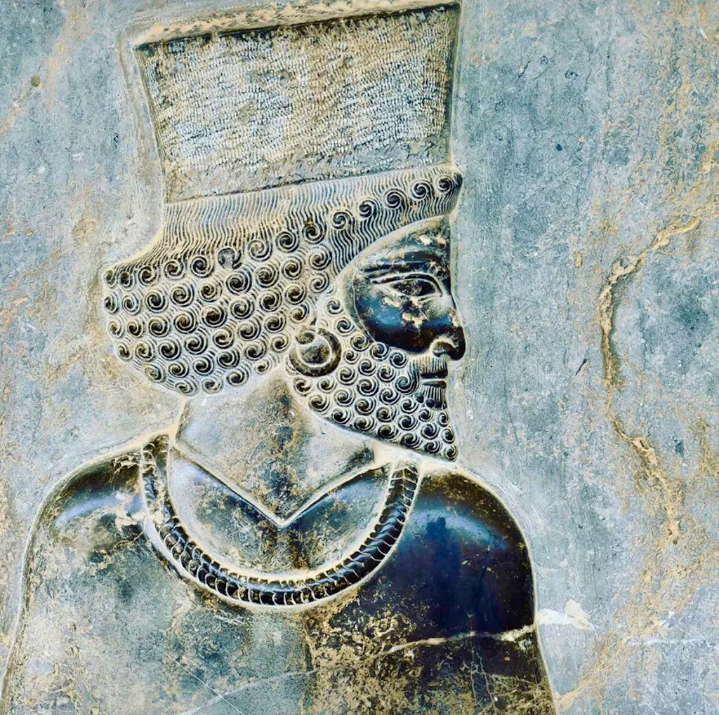 A relief depicting a man wearing a hat.