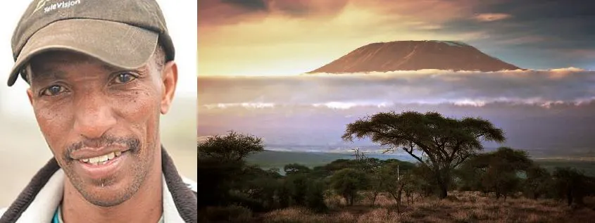 A man with a hat and a picture of a mountain.
