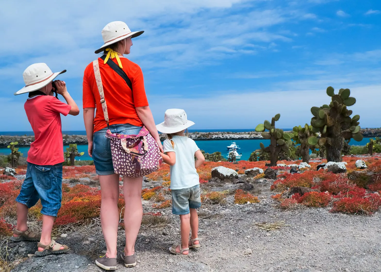 A woman and her children explore the ocean.