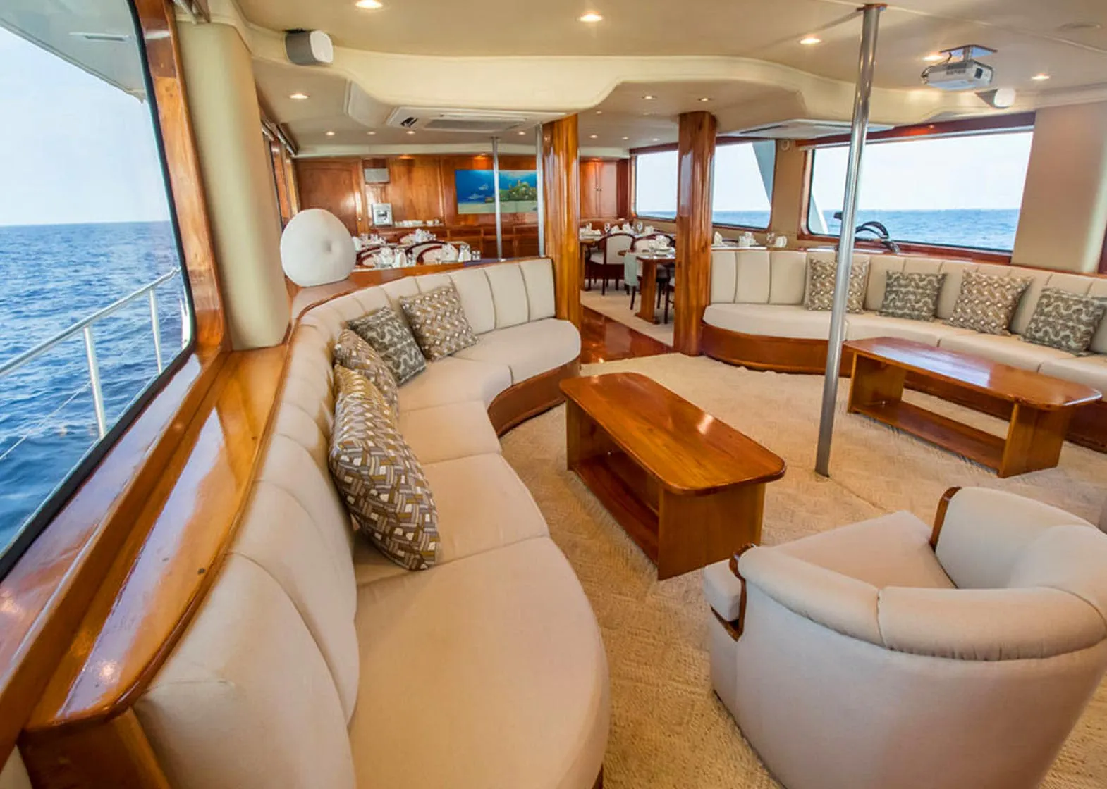 Integrity Adventure Tours boat with couches and tables.