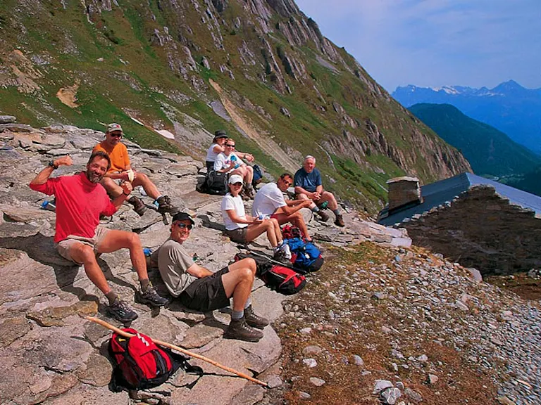 happy hikers meeting each other on the Alps Tour du Mont Blanc