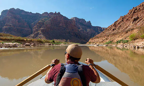 Man Rowing on Colorado River in Cataract Canyon, Utah