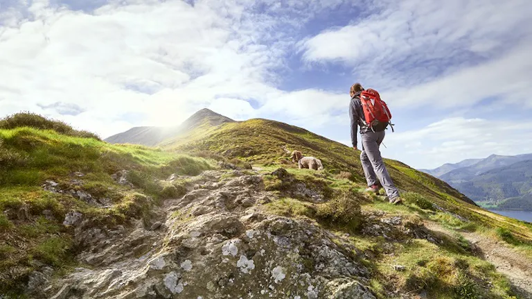 female hiker with a dog 
