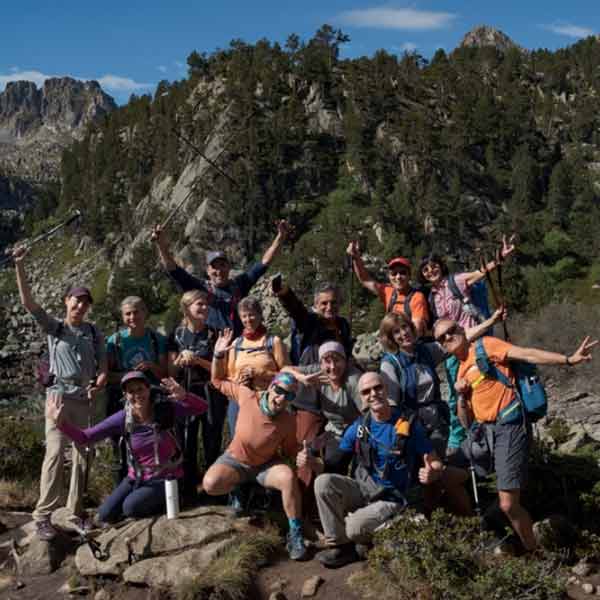 A group of hikers posing for a photo in the mountains.