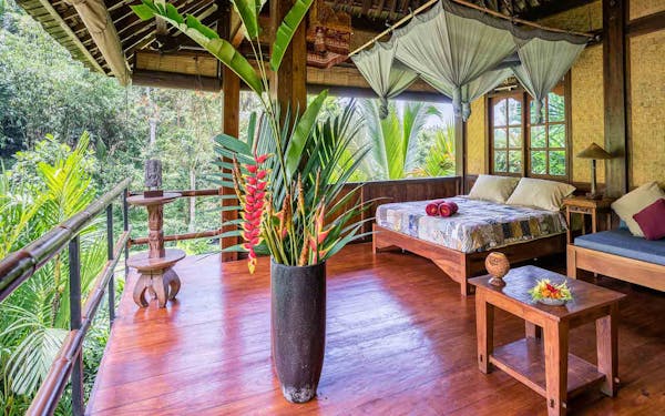 A bed or beds in a room at santa fe jungle lodge.