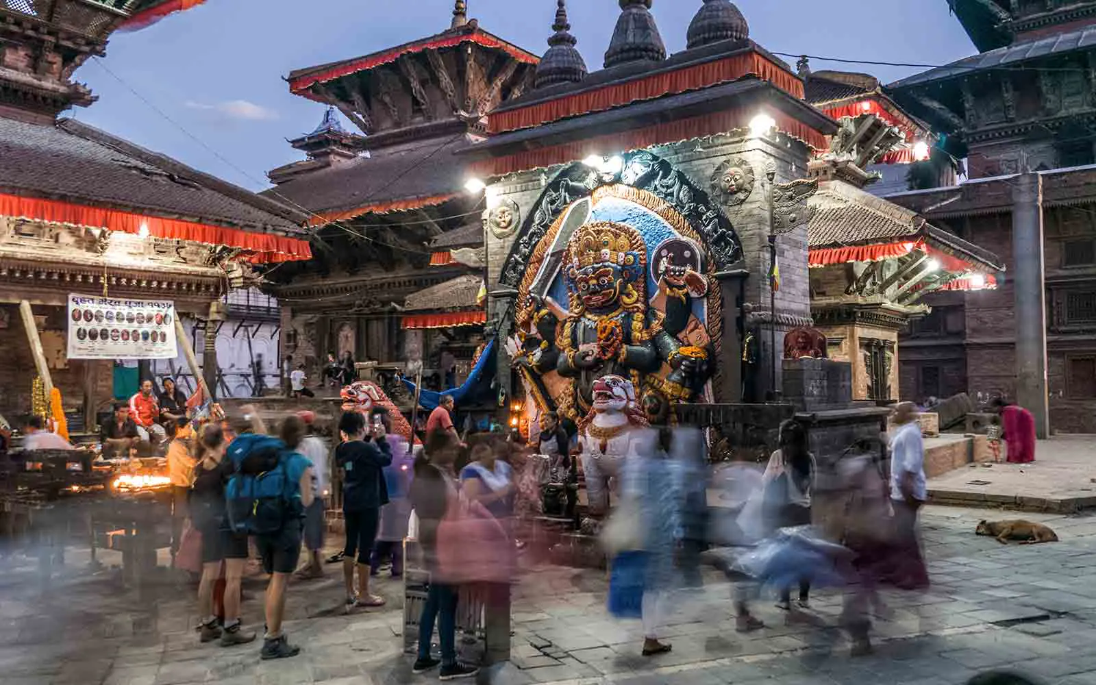 Nepal Trekking Adventures - A group of people walking around a temple in Nepal.