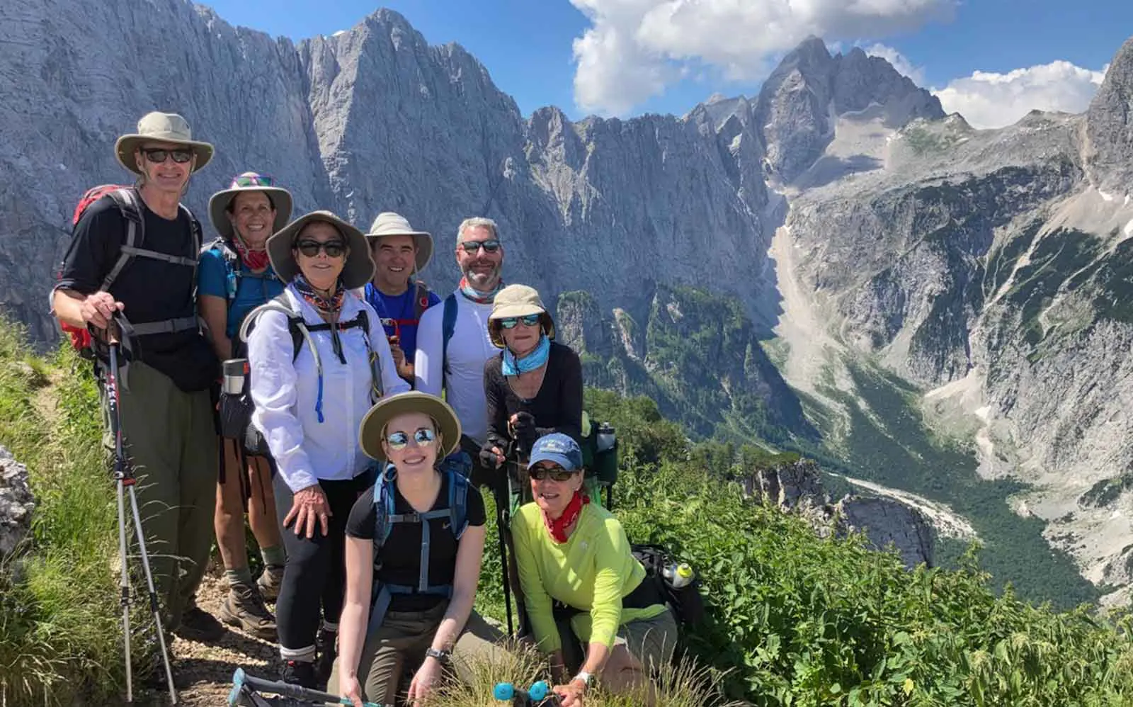 A group of hikers capturing the best alps hiking adventure in a photo.