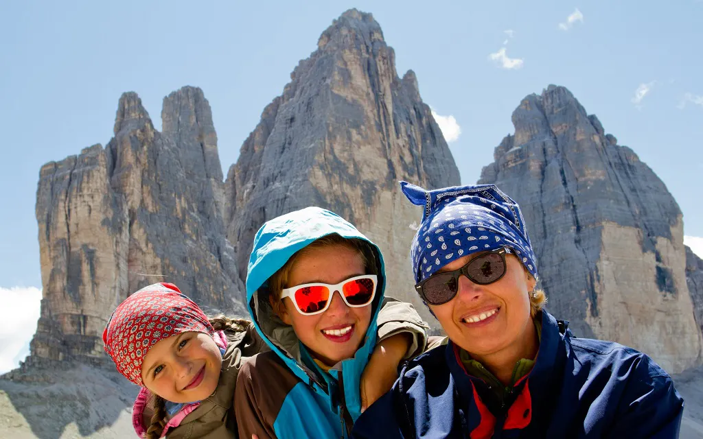 Family on a hike at Tre Cime di Lavaredo in the Dolomites, Italy