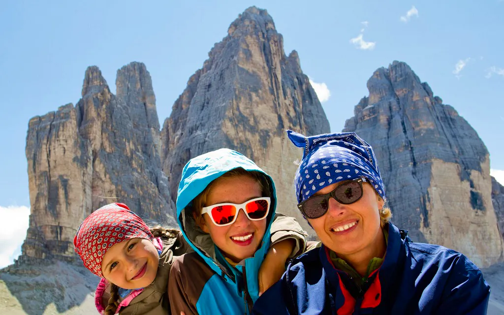 Family on a hike at Tre Cime di Lavaredo in the Dolomites, Italy