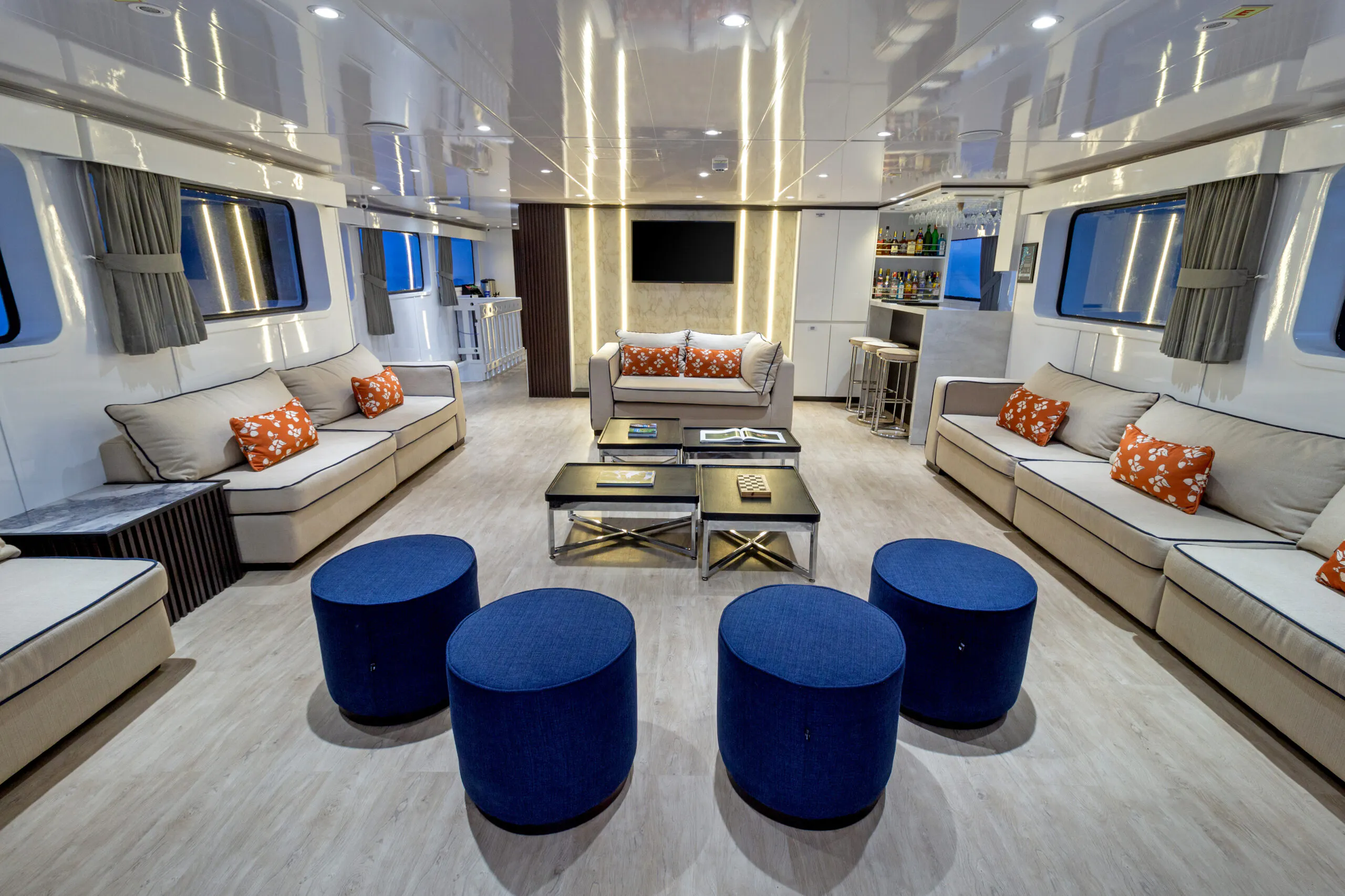Galaxy Adventure Tours offers a unique living room experience on their boat, complete with cozy couches and comfortable stools.