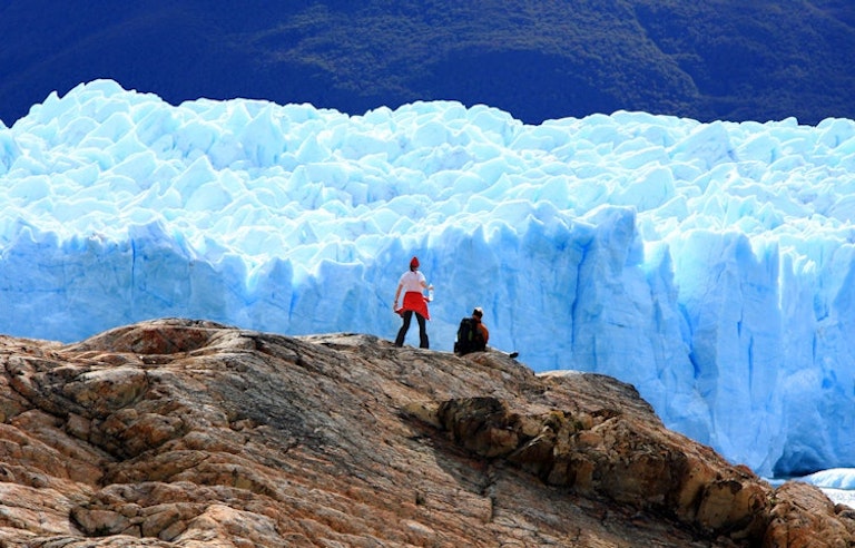 walking with family in Patagonia, Argentina facing beautiful landscape mountains 