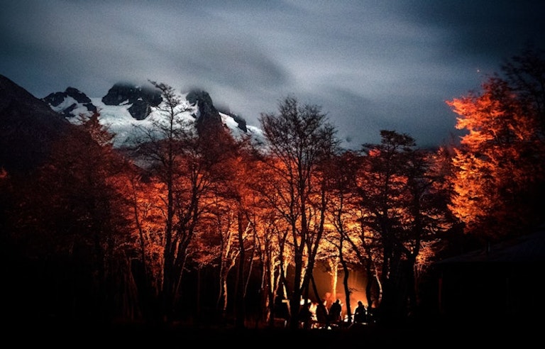 night foggy sky looking down at group of weary travelers in Patagonia