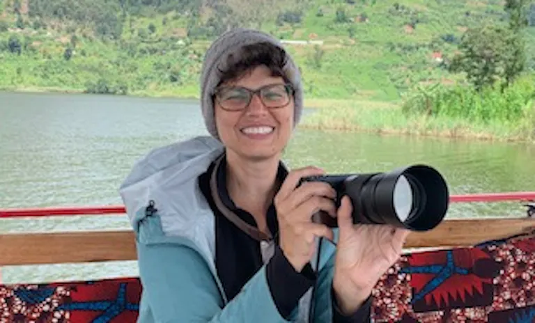 female woman with a camera and glasses in Uganda Gorilla Safari in Africa