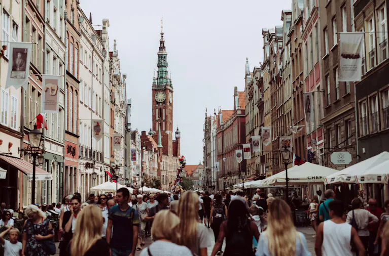 queue of people lining up at the street