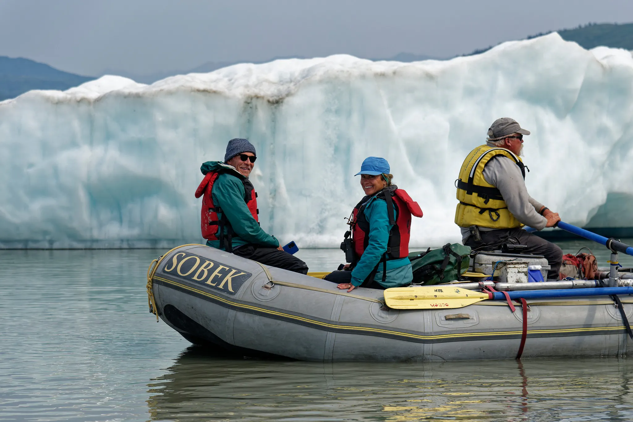 MT Sobek group of travelers rafting the Alsek River in Alaska with a guide