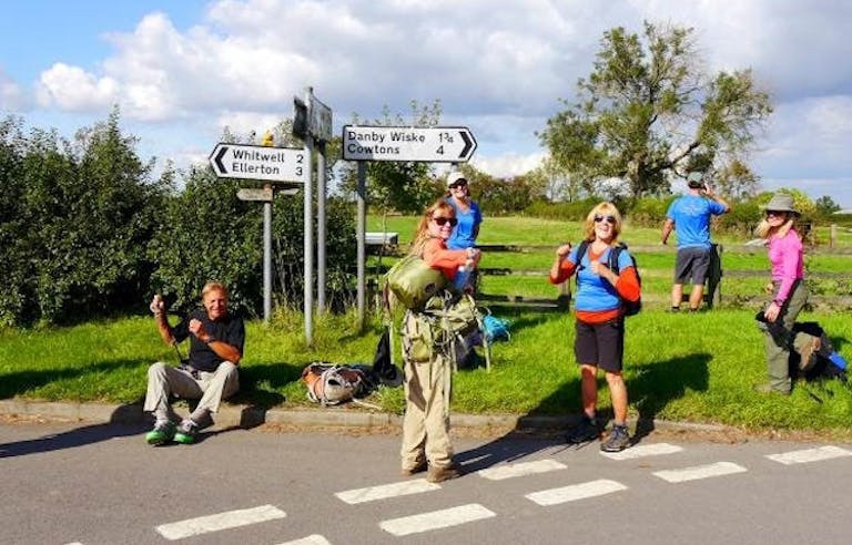 MT Sobek travelers pausing to take scenic photos as they trek the great England Coast to Coast trail. Colorful photo.