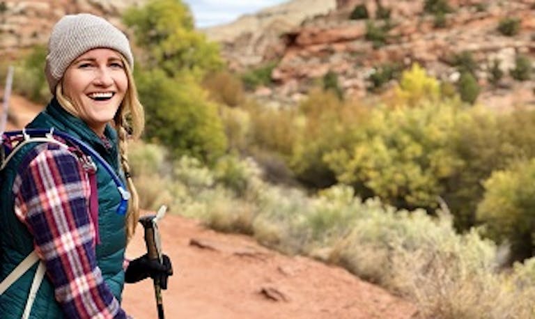 female hiker on trail in Utah National Parks in USA