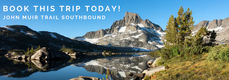 A mountain with the words book this trip today.