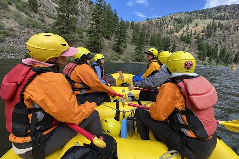 group of rafters on a kayak with a guide in the Middle Fork of the Salmon River in Idaho, North America