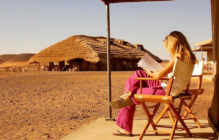 girl reading a book in sudan