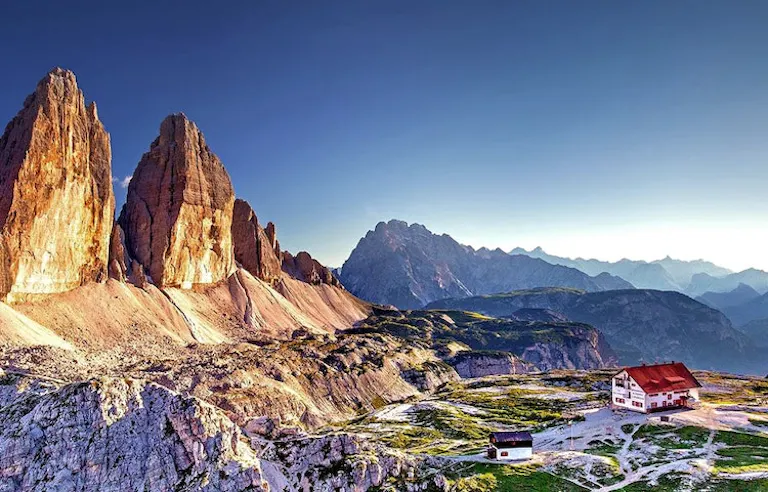 A village with the backdrop of Dolomites A village with the backdrop of Dolomites