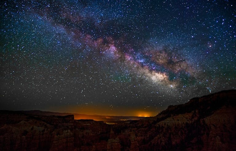 Tourist enjoying stargazing opportunities in Utah